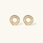 Gold-plated necklace and earring set with circular CZ crystal pendants featuring radial design on cream background