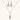 Gold-plated teardrop necklace and earrings covered in AAA cubic zirconia crystals on cream background.