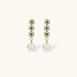 Gold-plated jewelry set with green cubic zirconia floral motifs, featuring matching necklace and pearl drop earrings