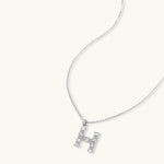 Letter H jewelry set featuring geometric crystal design in gold and white gold plated finish with adjustable chain necklace