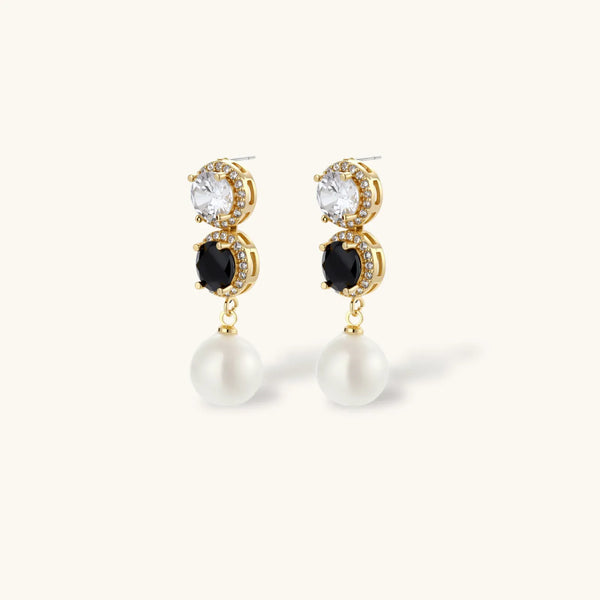 Gold-plated jewelry set with alternating black and clear cubic zirconia stones, featuring necklace, earrings and bracelet