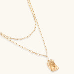Layered paperclip chain necklace with organic flowing pendant made from eco-zinc alloy in warm gold finish