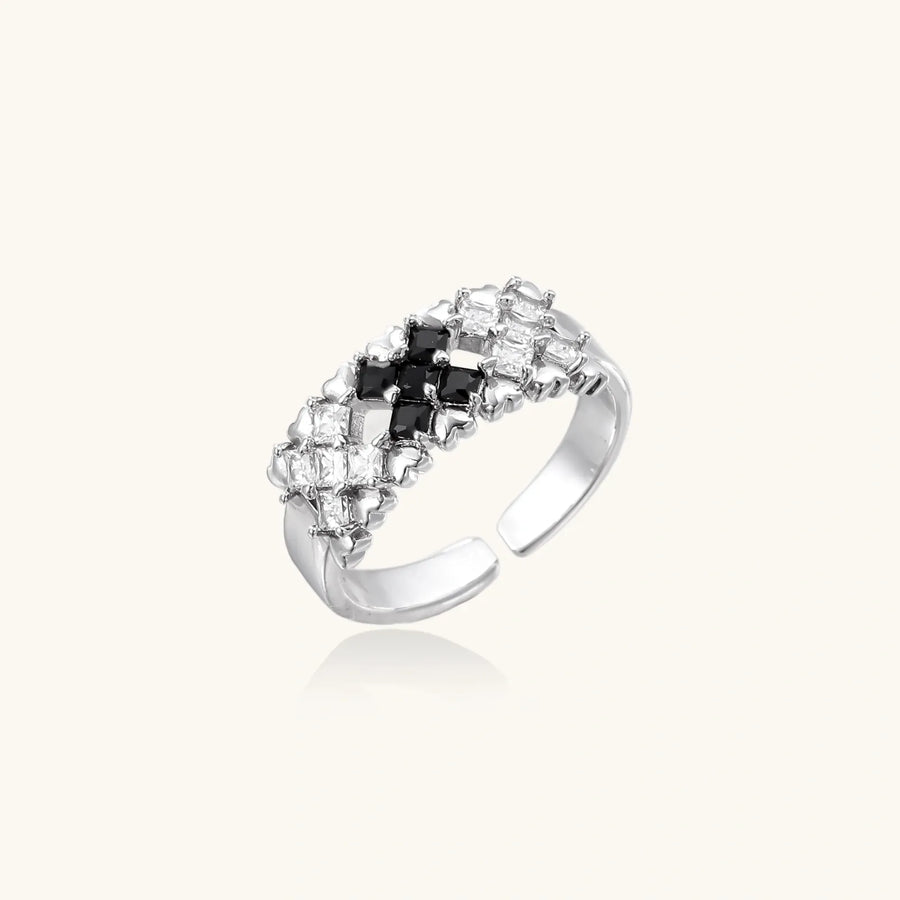 Adjustable white gold plated ring with geometric grid of black and clear zirconia stones in checkerboard pattern