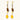 Gold-plated dangle earrings with brown gemstones, star charms, and yellow amber drops on cream background.