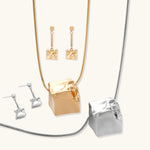 Geometric jewelry set with textured cube pendants on chains, featuring eco-zinc alloy in silver and gold finishes.
