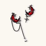 Gothic jewelry set with asymmetrical black metal earrings featuring red crescent moons, stars, and layered necklaces with heart pendants