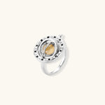 Complete jewelry set featuring citrine stone chips, silver beads, and cosmic circle pendants on cream background.