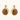 Gold-toned dangle earrings with organic brown resin stones and crystal accents on white background