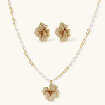 14K gold-plated flower jewelry set with zirconia crystals, featuring dimensional petal necklace and matching earrings