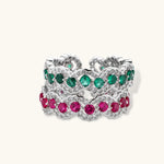 Platinum-plated copper ring with green zirconia stones in decorative scalloped wave pattern, adjustable band design.