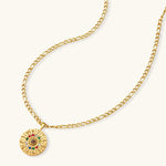 Gold-tone zodiac wheel pendant with 12 colorful cubic zirconia stones on a figaro chain, 18K gold plated stainless steel.