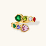 Gold-plated wrap ring with bezel-set multicolor heart-shaped cubic zirconia stones in pink, purple, green, red, yellow, and white.