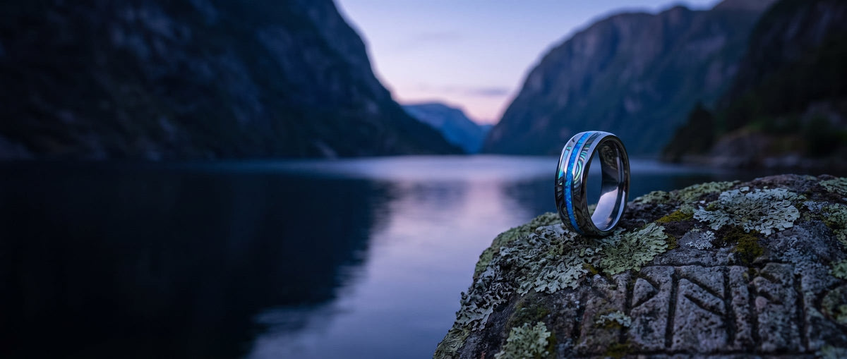 Norse ring on a carved rune stone above a Norwegian fjord